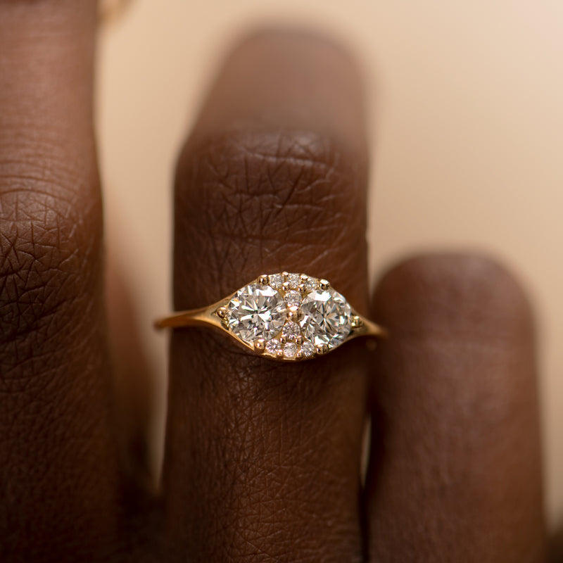 Dual-Diamond-Engagement-Ring-with-a-Cluster-of-Brilliant-Cut-Diamonds-shiny