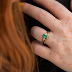 Emerald-Engagement-Ring-with-A-Small-Diamond-asymmetric-Emerald-Ring-in-set
