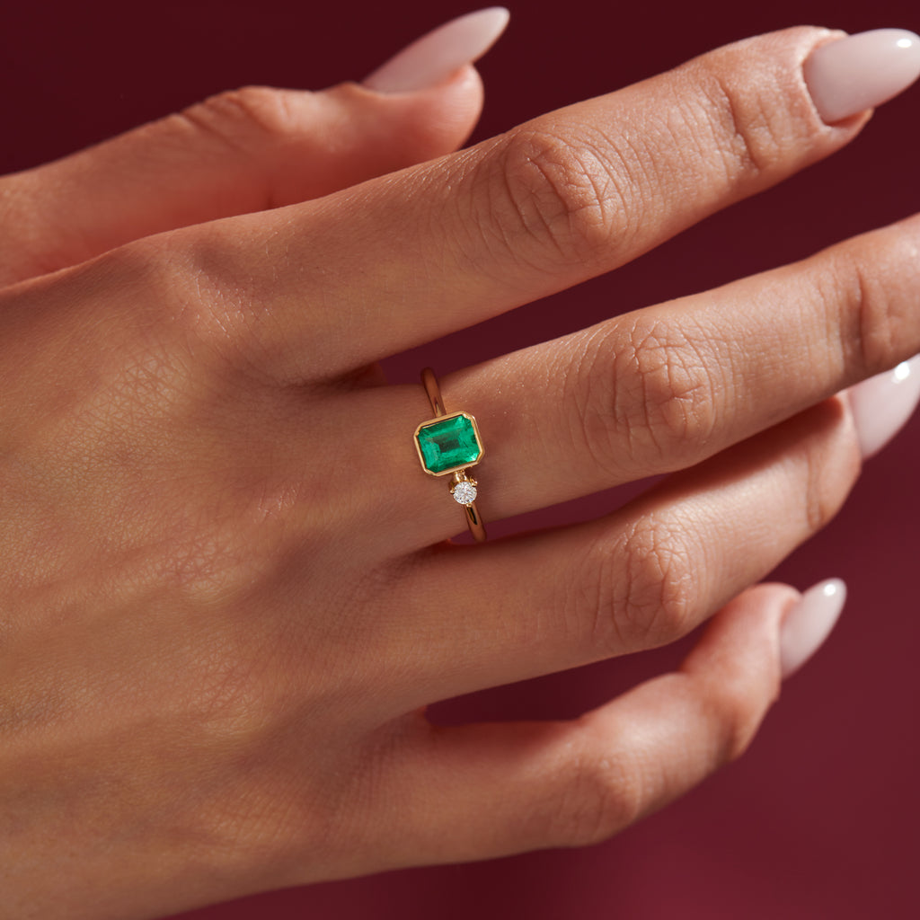 Emerald Engagement Ring with A Small Diamond Asymmetric Emerald