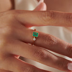 Emerald-Engagement-Ring-with-A-Small-Diamond-symmetric-Emerald-Ring-side-shot