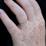 Eternity-Wedding-Ring-with-Baguette-Diamonds-Art-Deco-Style-Wedding-Band-on-finger