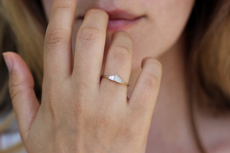 Five Baguette Diamonds Engagement Ring on finger