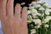 Frontal View Of Emerald And Diamond Eternity Wedding Band