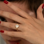 Geometric-Emerald-Cut-Diamond-Engagement-Ring-on-finger