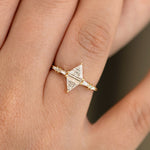 Geometric Engagement Ring with Triangle and Baguette Diamonds on Hand detail shot up close 