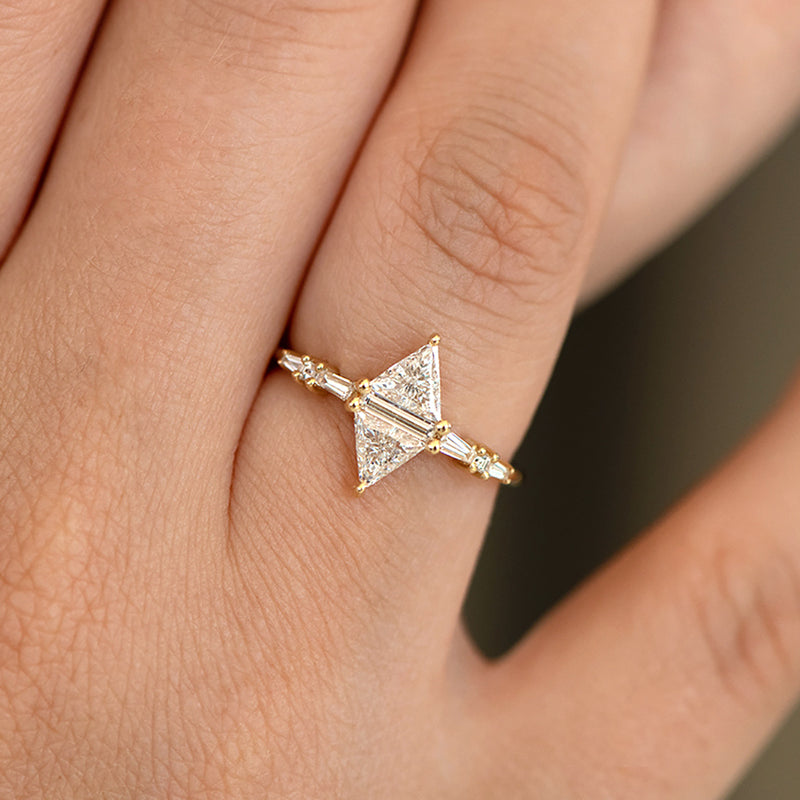 Geometric Engagement Ring with Triangle and Baguette Diamonds on Hand detail shot up close 