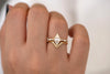 Geometric Engagement Ring with Triangle and Baguette Diamonds on Hand in set detail shot 