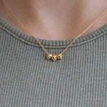 Gold Skull Necklace on Body 