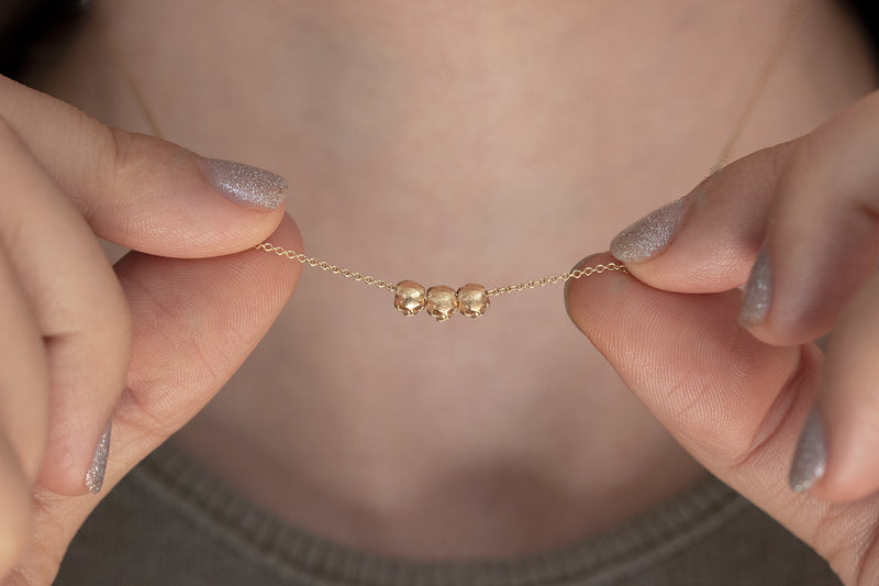 Gold Skull Necklace on Body 