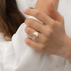 Golden-Radio-Ring-with-Baguette-Diamond-Pave-on-finger