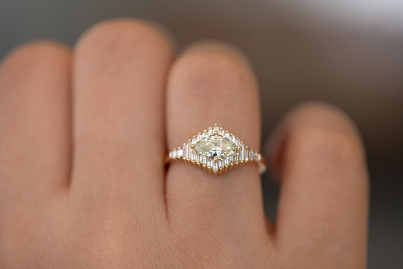 Green Diamond Engagement Ring with Baguette Diamonds - Fancy Color Diamond Ring on hand up close lower angle 