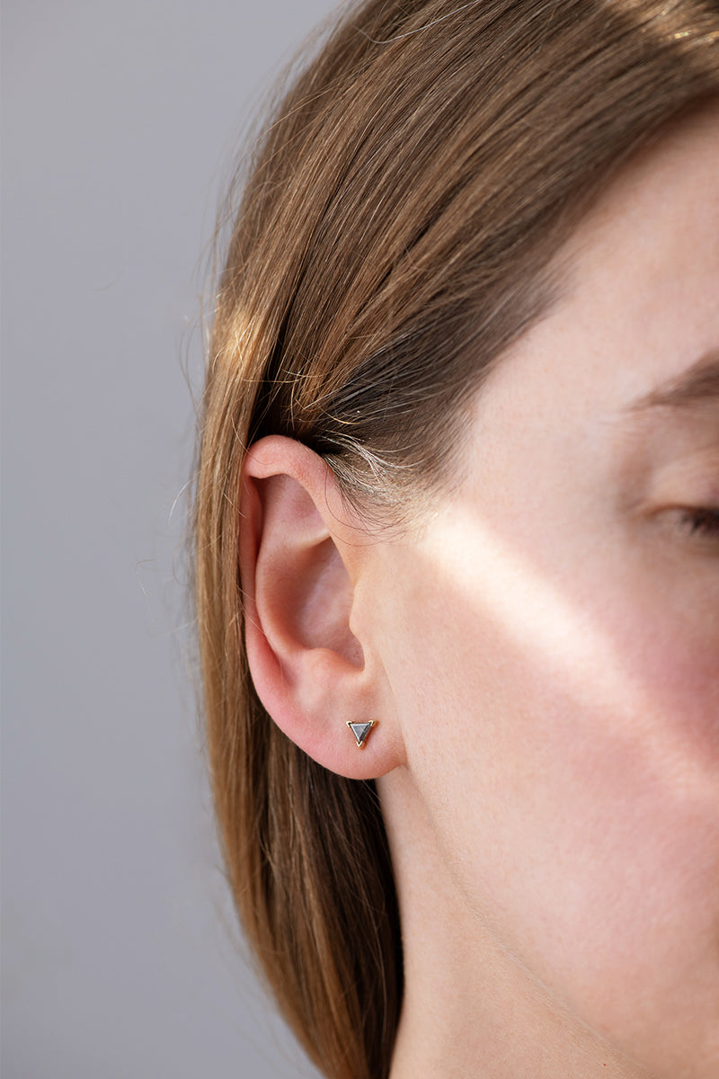 Grey Triangle Diamond Stud Earrings on Ear Side View 