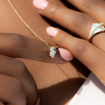 Half-Moon-Diamond-and-Gold-Necklace-The-Moon-Beam-on-finger
