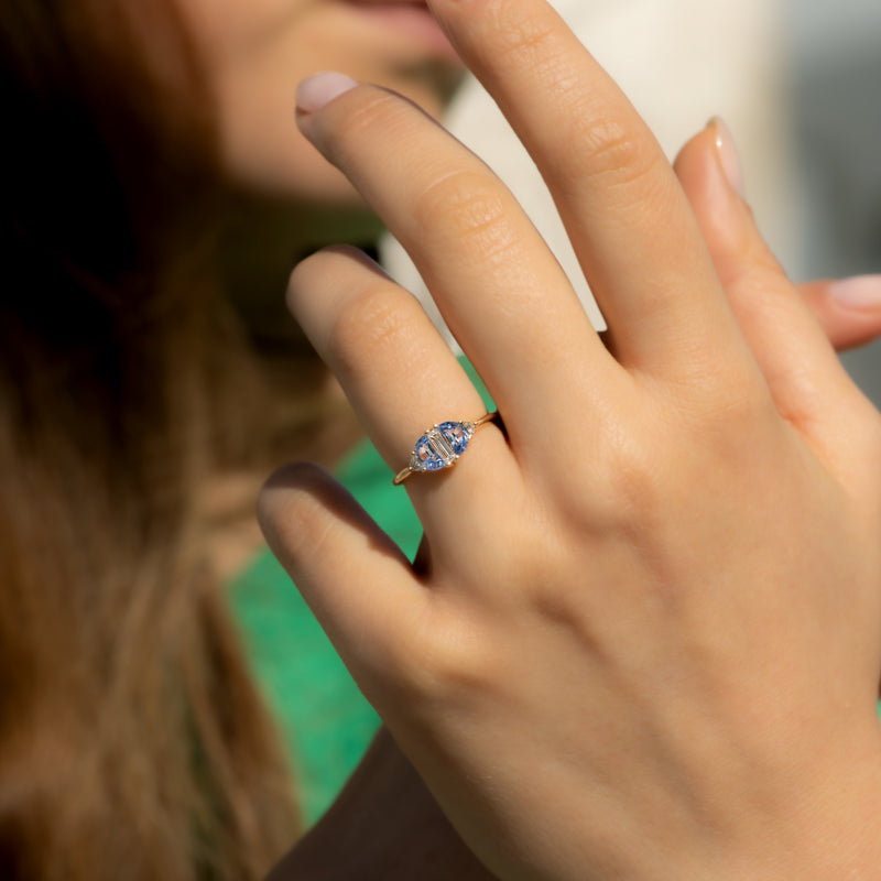 Half-Moon-Sapphire-Engagement-Ring-with-Baguette-Cut-Diamond--on-finger