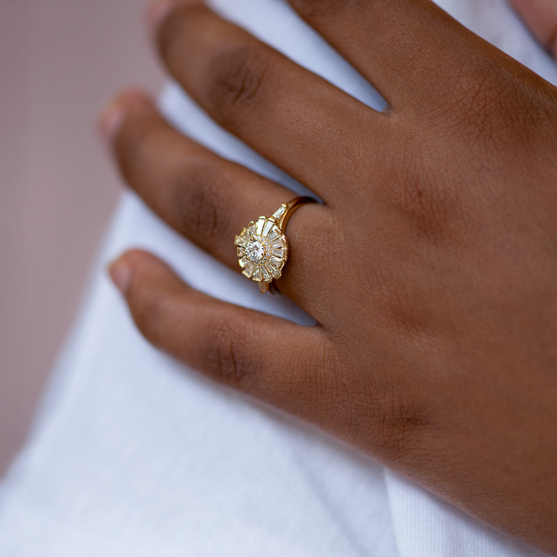 Halo-Ring-with-Baguette-Diamond-Frills-Asymmetric-Halo-Engagement-Ring-on-finger