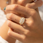 Interlaced-Pear-Diamond-Engagement-Ring-on-finger