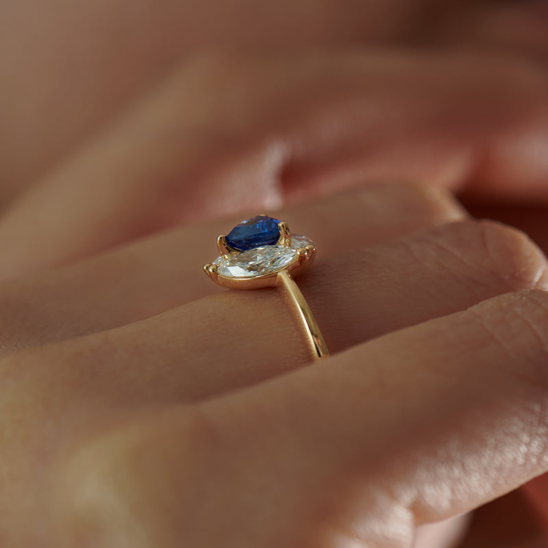 Marquise-Diamond-and-Royal-Blue-Trillion-Sapphire-Engagement-Ring-side-shot