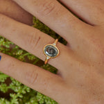 Minimalistic-Oval-Cut-Salt-and-Pepper-Engagement-Ring-on-finger