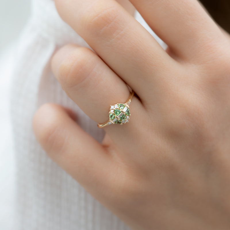 Mint-Garnet-and-Diamond-Cluster-Engagement-Ring-on-finger