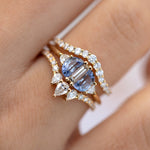 Nesting-Diamond-Ring-with-Three-Pear-Cut-Diamonds-on-finger