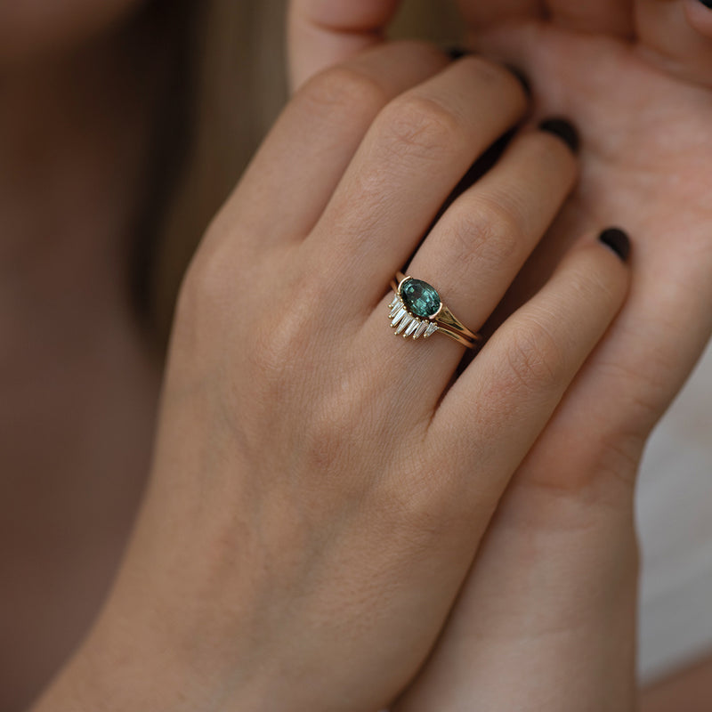 Nesting-Wedding-Ring-with-Baguette-Diamonds-on-finger