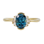 OOAK-Oval-Cut-Teal-Sapphire-Engagement-Ring-with-White-Diamond-Wings-closeup