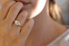 One Carat Trillion Cut Diamond Engagement Ring on ring finger