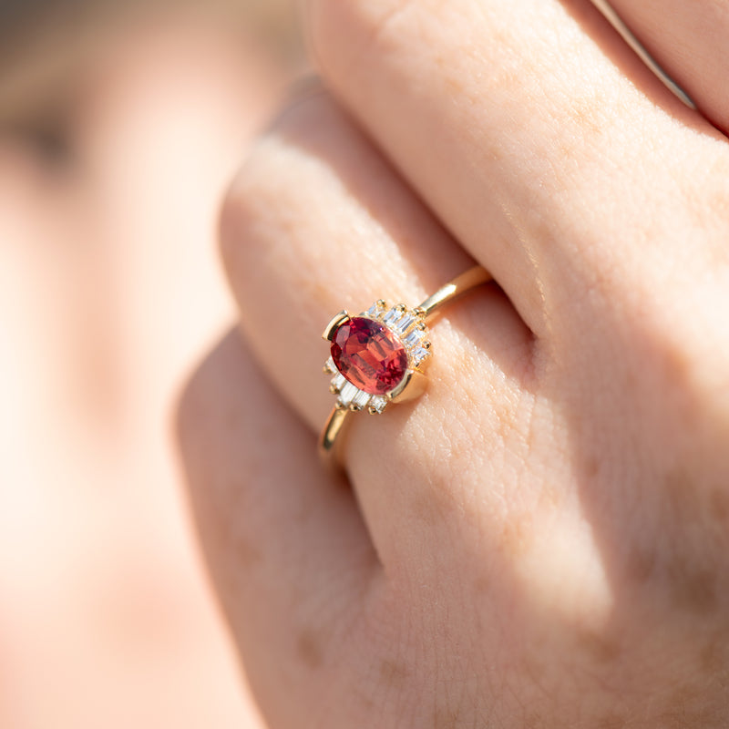 Oval-Cut-Padparadscha-Engagement-Ring-with-Baguette-Diamond-Wings-OOAK-ON-FINGER