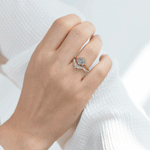 Oval-Cut-Salt-and-Pepper-Diamond-Engagement-Ring-with-Baguette-Frills-on-hand-in-set-top-shot