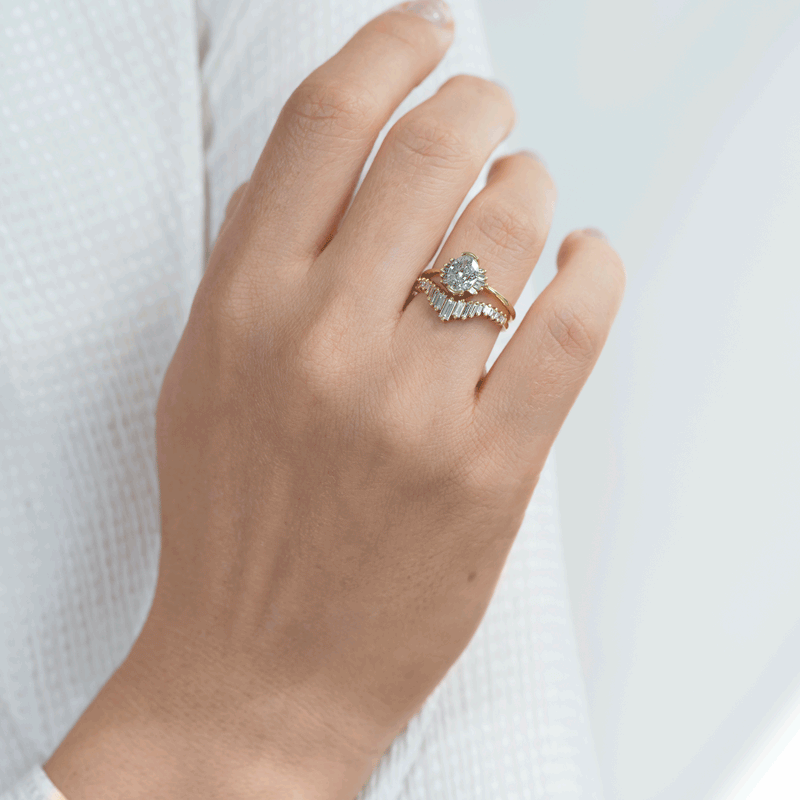 Oval-Cut-Salt-and-Pepper-Diamond-Engagement-Ring-with-Baguette-Frills-on-hand-in-set