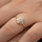 Oval-Cut-Salt-and-Pepper-Diamond-Engagement-Ring-with-Baguette-Frills-on-hand