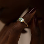Paraiba-Tourmaline-Engagement-Ring-with-Delicate-Diamond-Detailing-OOAK-on-finger
