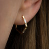 Pentagon-Shaped-Hoop-Earrings-with-Baguette-Diamonds-side-shot-side-closeup