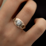 Piercing-Engagement-Ring-with-Grommets-and-a-Grey-Diamond-Halo-moment