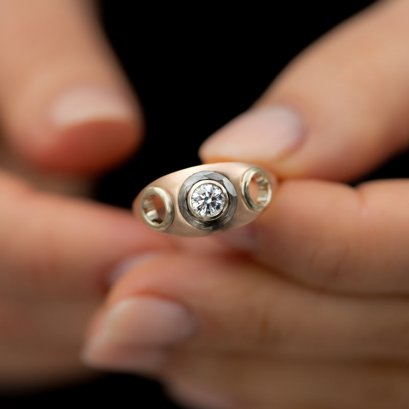 Piercing-Engagement-Ring-with-Grommets-and-a-Grey-Diamond-Halo-top-shot