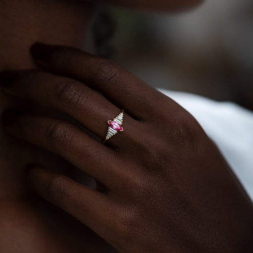 Pink-Spinel-Engagement-Ring-with-a-Dainty-Diamond-Lineup-on-finger