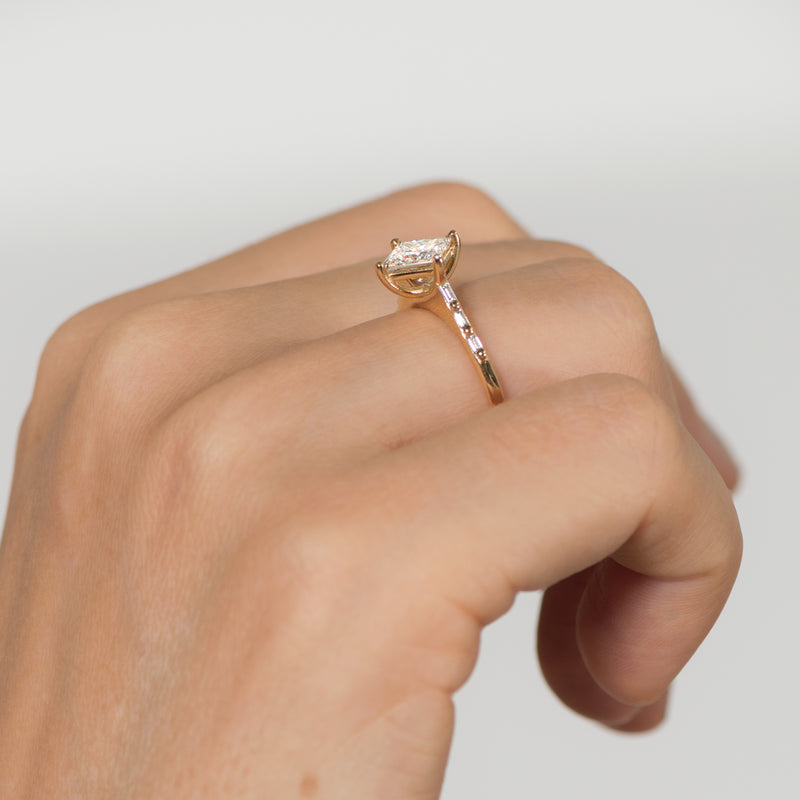 Princess-Cut-Solitaire-Engagement-ring-with-Baguette-Diamond-Detailing-OOAK-moment