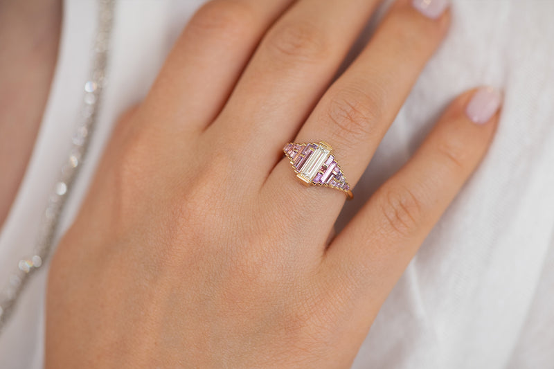 Purple and Lilac Sapphire Ring with Baguette Diamond on Hand in Sun