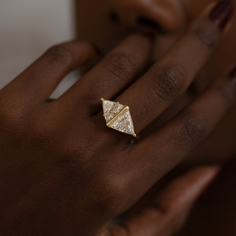 Pyramid-Engagement-Ring-with-Trillion-and-Trapeze-Cut-Diamonds-side-shot-on-finger