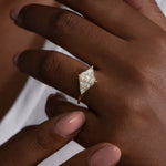 Rhombus-Engagement-Ring-with-Mixed-Diamond-Cuts-on-finger
