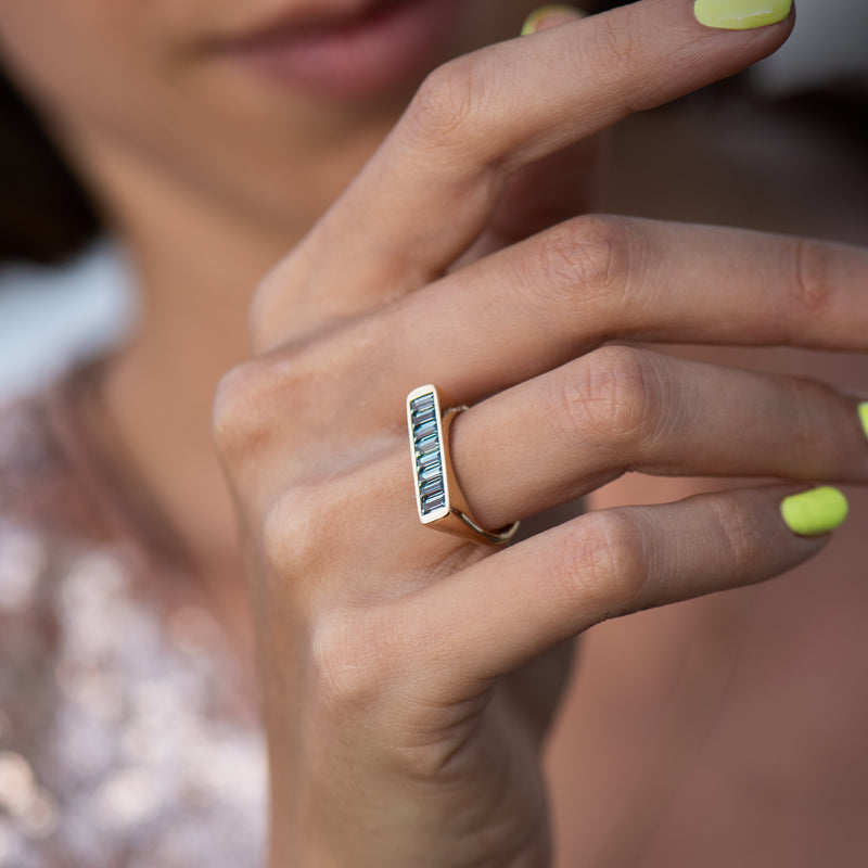 River-Bank-Statement-Ring-with-Baguette-Cut-Teal-Sapphires-on-finger