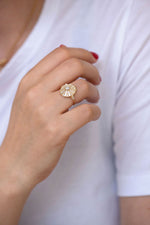 Round Engagement Ring with Long Tapered Baguette Diamonds on hand other angle 