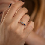 Salt-and-Pepper-Diamond-Ring-with-Blue-Sapphires-on-finger