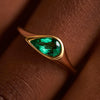 Solitaire-Engagement-Ring-with-a-Pear-Cut-Emerald-solid-gold