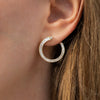 Spiral-Hoop-Earrings-with-Tapered-Baguette-Diamonds-closeup-top-shot