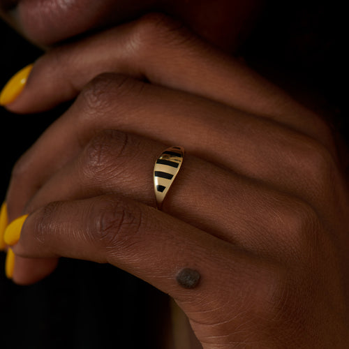Stria-Gold-and-Black-Enamel-Ring-on-finger