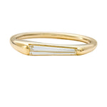 Tapered-Baguette-Solitaire-Engagement-Ring-with-a-Modern-Golden-Bezel-CLOSEUP