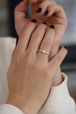 Tapered Baguette Engagement Ring on Hands 