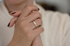 Tapered Baguette Engagement Ring on Hands 