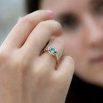 Teal-Sapphire-Engagement-Ring-with-Delicate-Diamond-Detailing-OOAK-on-finger
